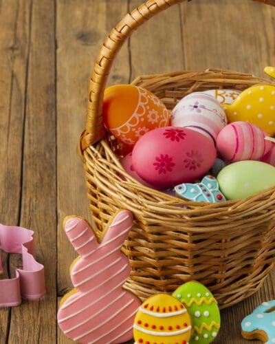 high-angle-colorful-easter-eggs-basket-with-bunny